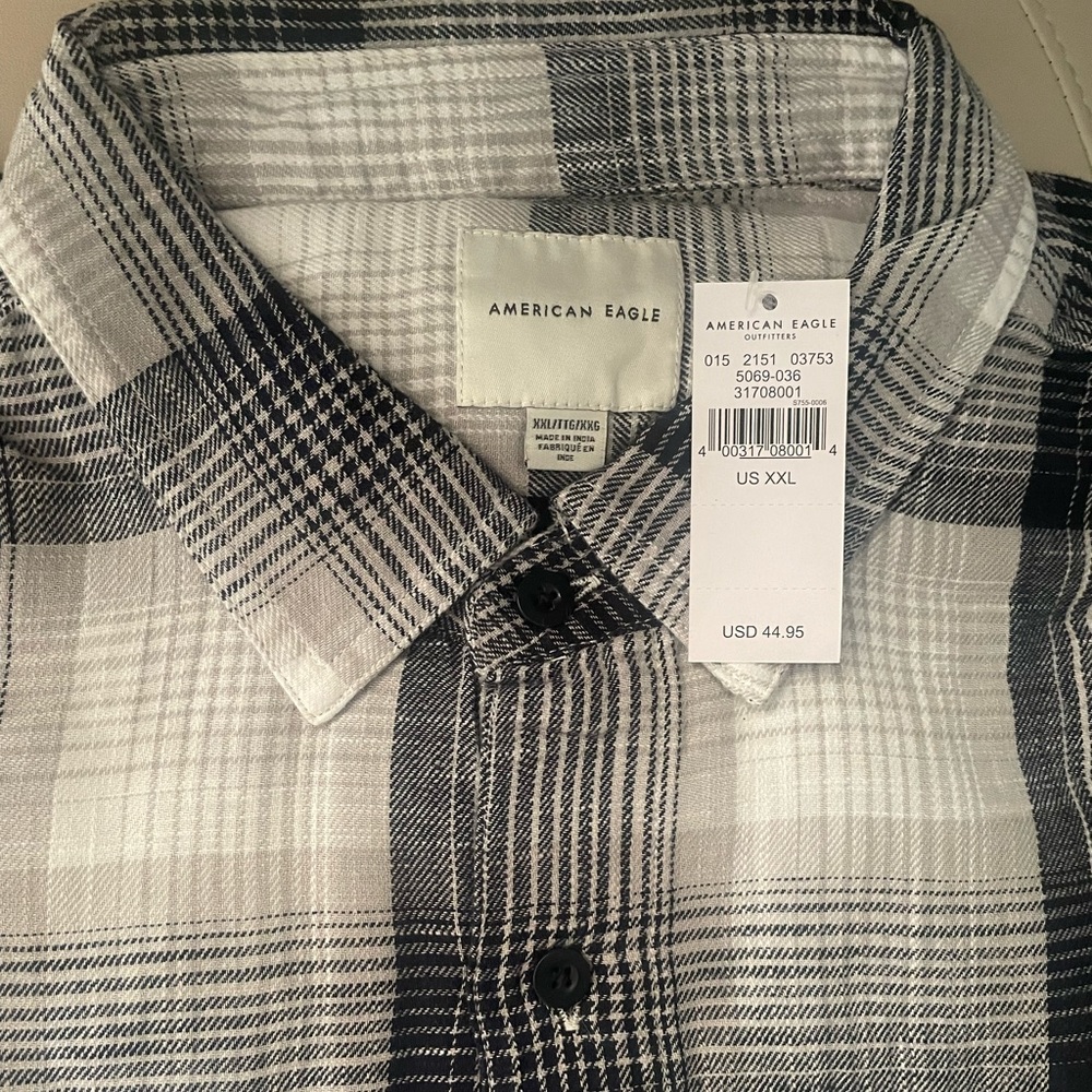 Never worn flannel plaid buttons down.
